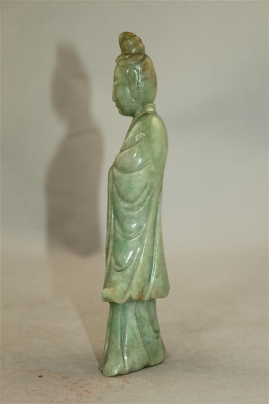 A Chinese jadeite standing figure of Guanyin, early 20th century, MEASUREMENT, wood stand